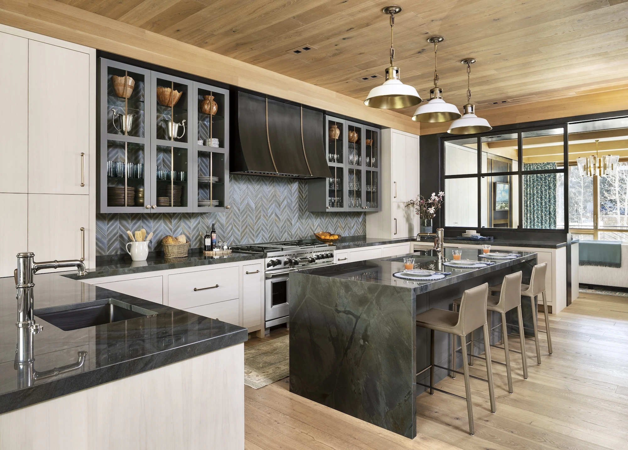 Gore Creek Row Home 1 kitchen with rich blue hues and chevron backsplash