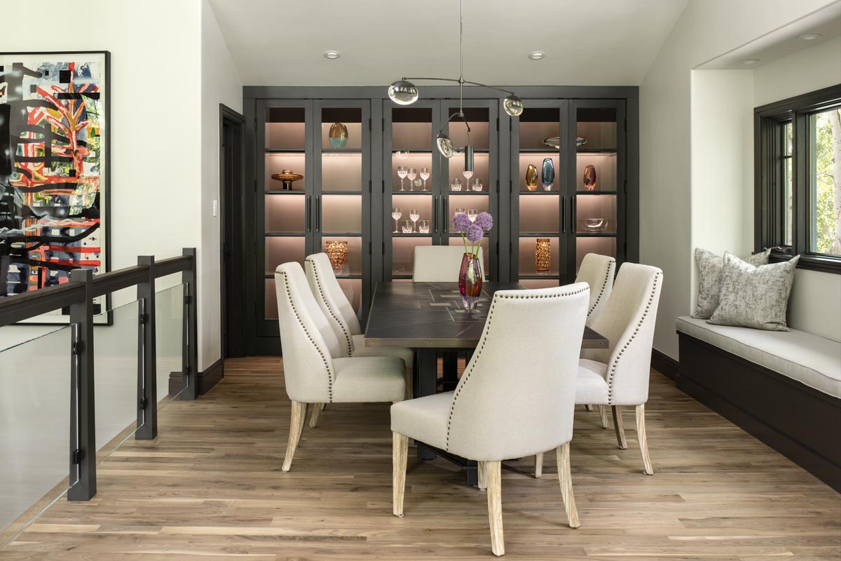 Snowmass Village Retreat kitchen detail with bleached walnut floors and brass-trimmed hood
