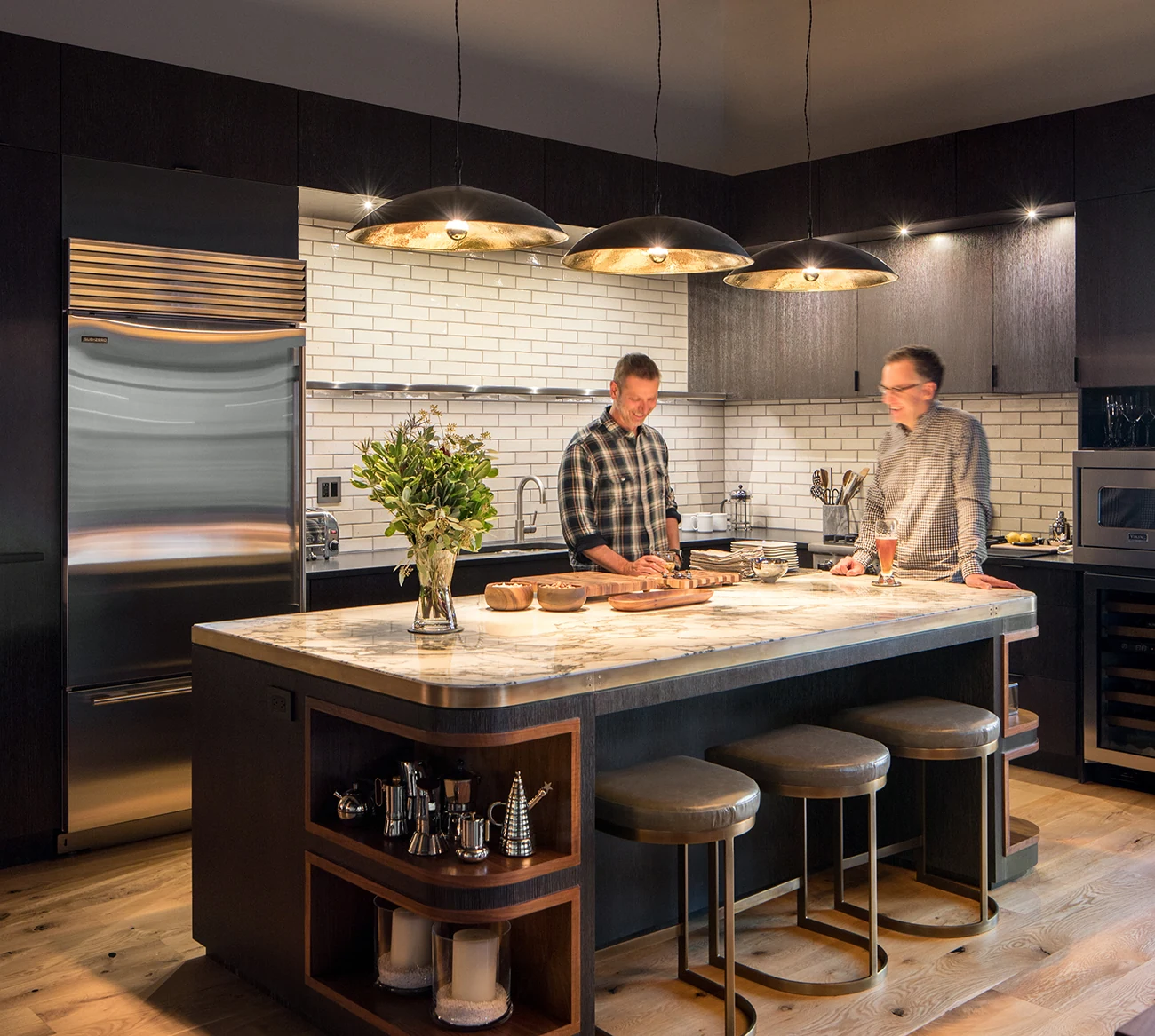 Loft Space kitchen with dark panel cabinetry and industrial design elements