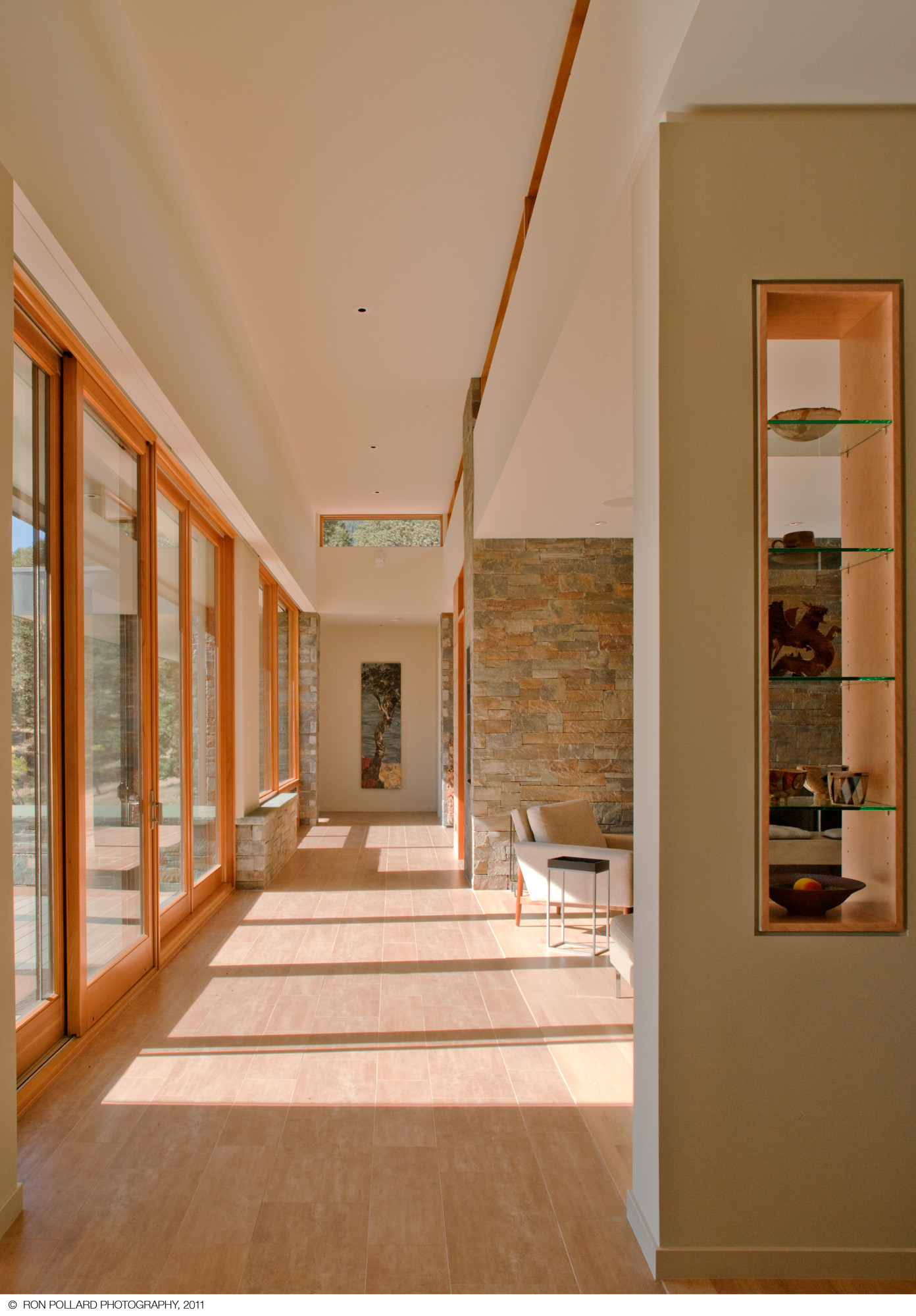 a long hallway lined with large windows at williams ridge