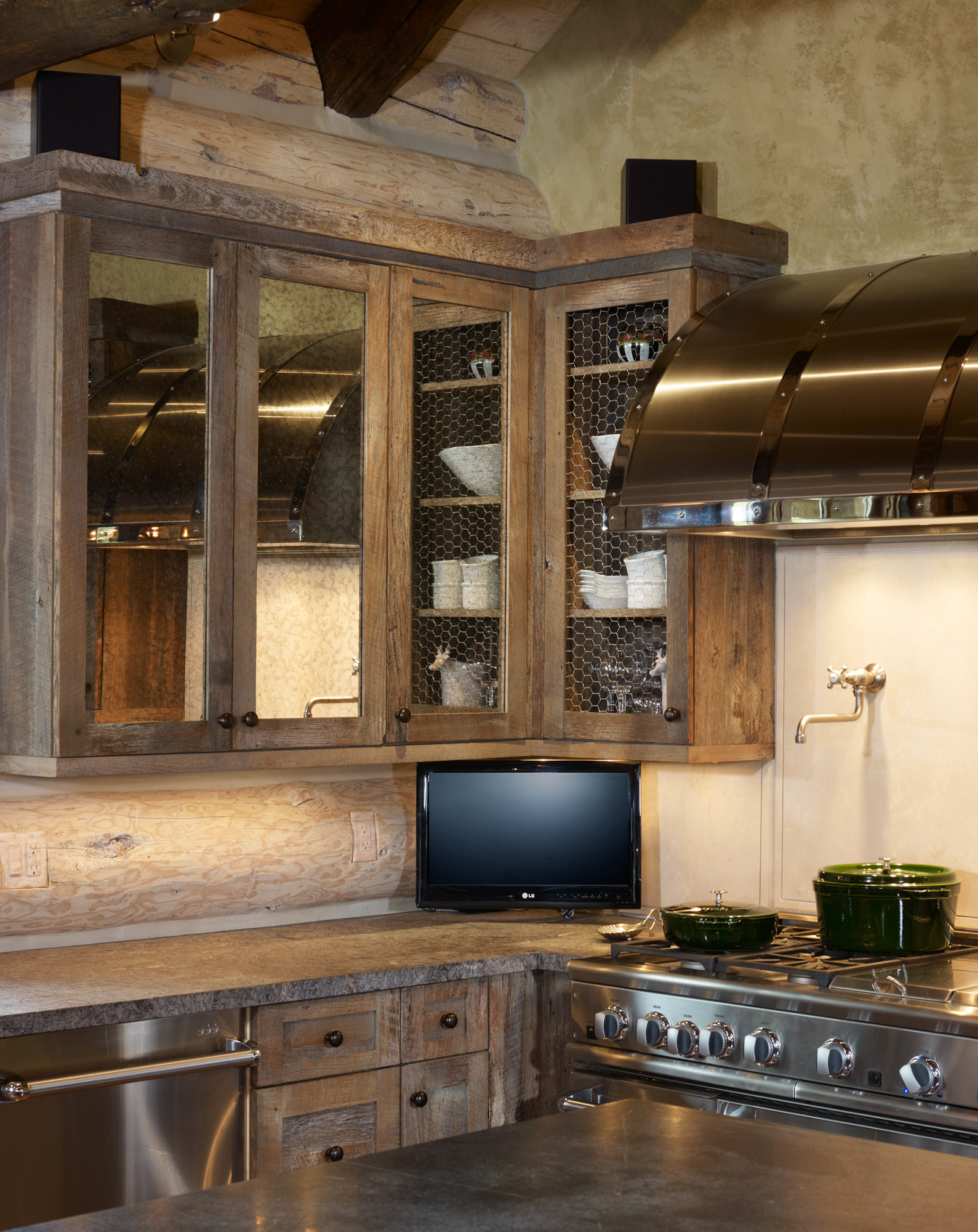 a view of a corner of the kitchen with chicken wire cabinets in dexter meadows