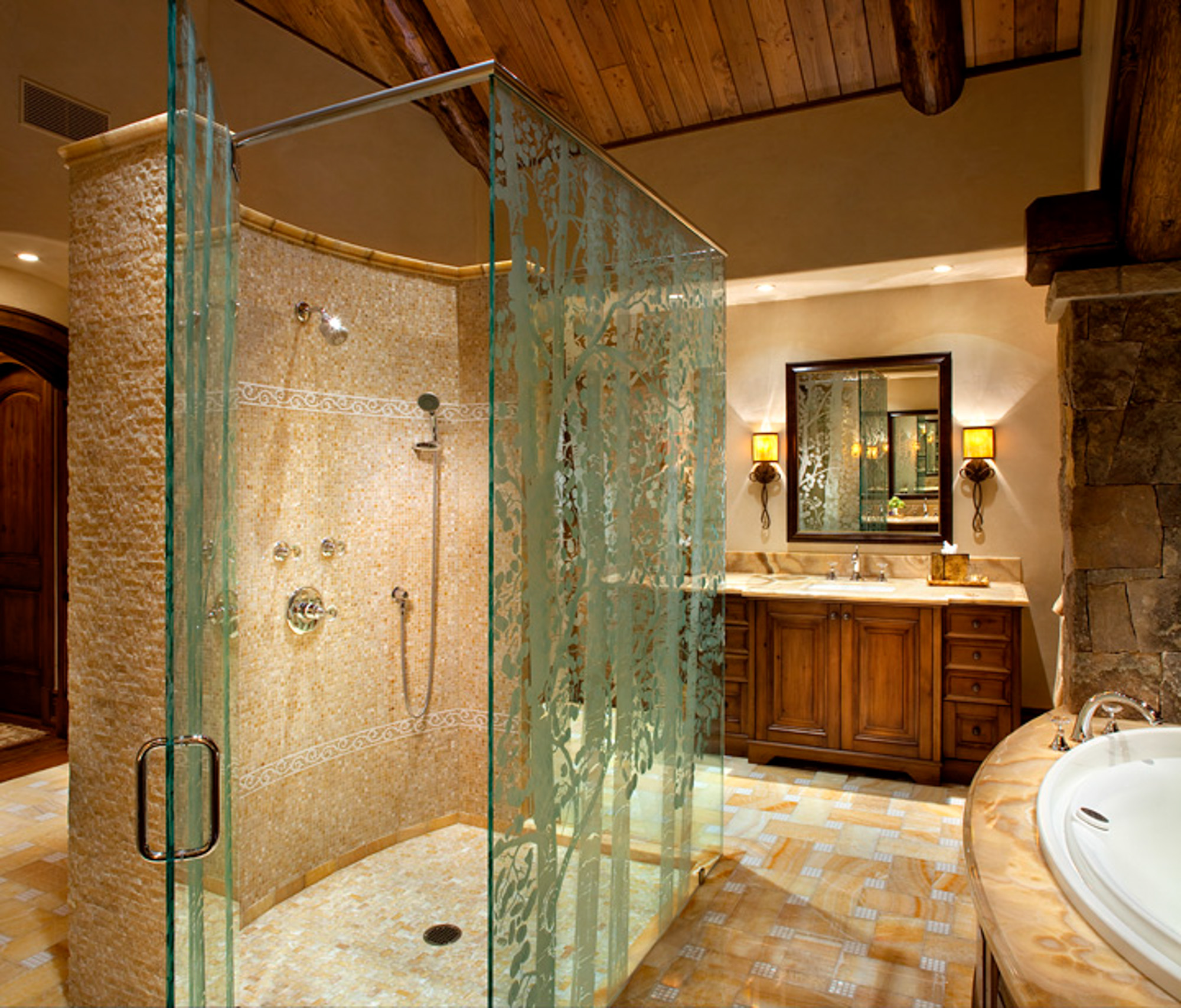 A view of the custom aspen print glass door in the shower at bachelor gulch