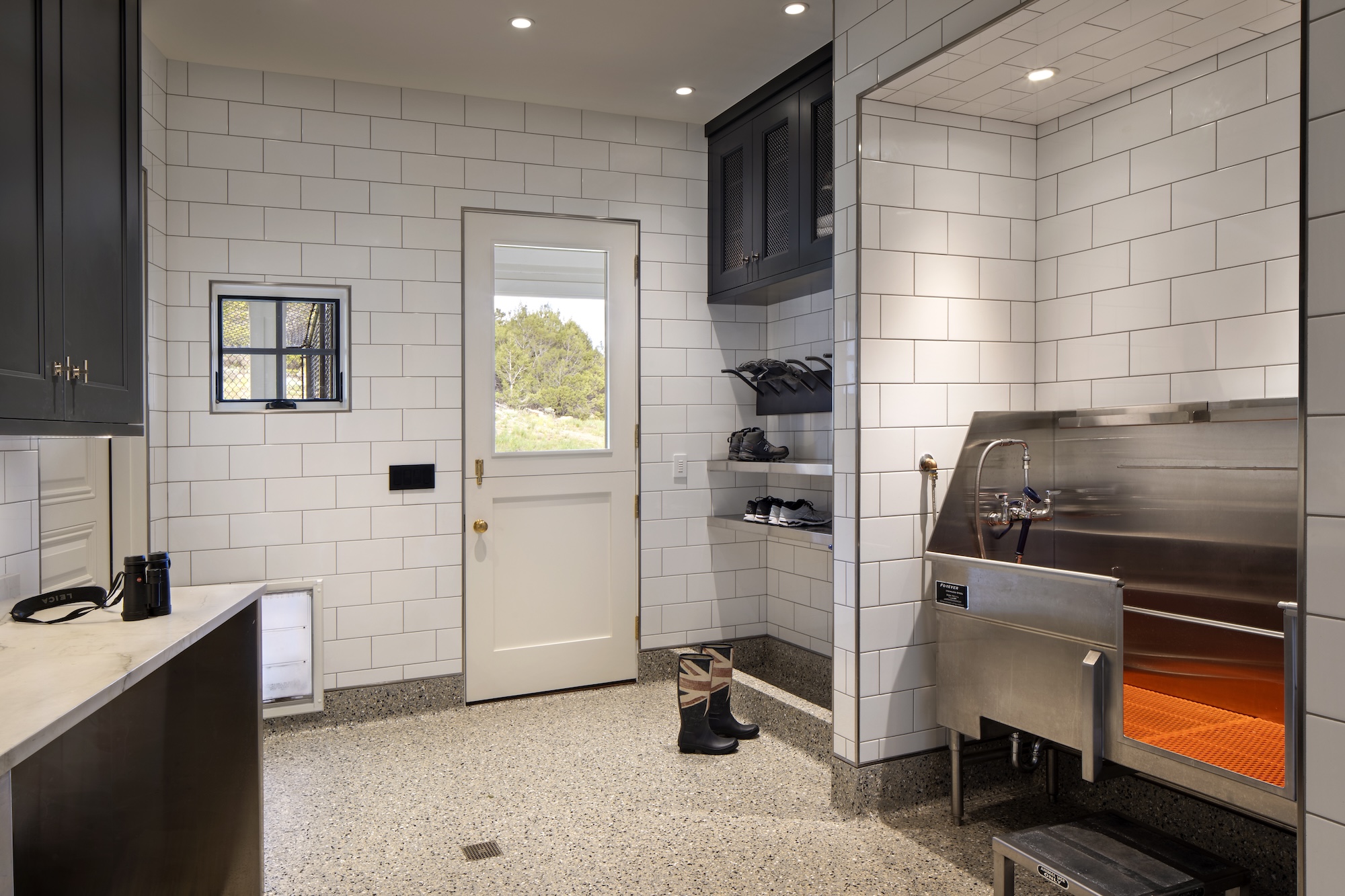 the mudroom with dog wash station at at golden eagle homestead