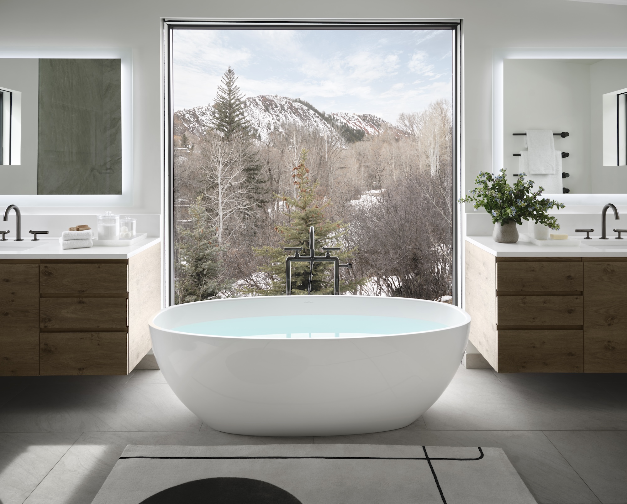 a large tub overlooking a mountain view at aspen modern