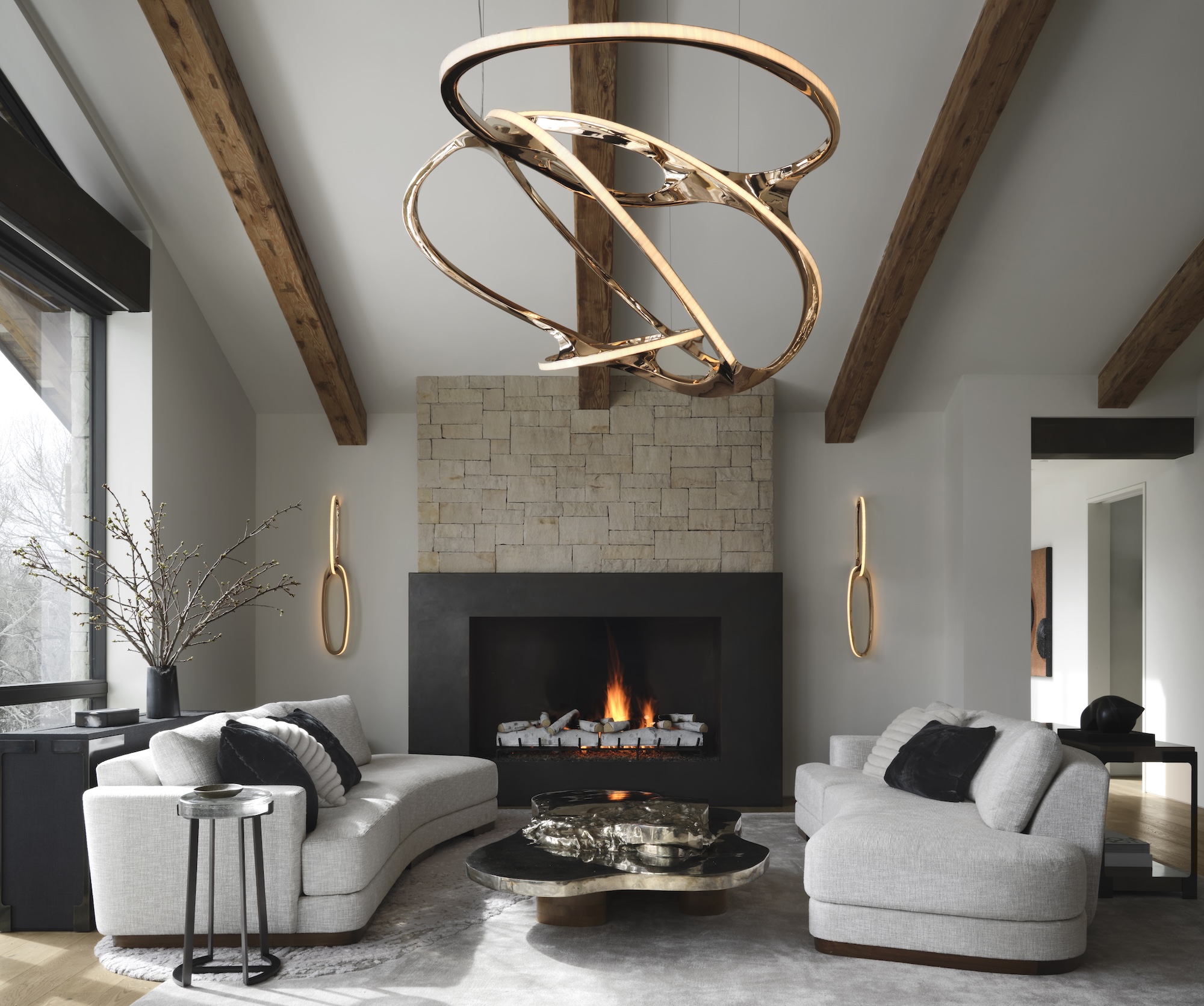 an elaborate swirling fixture over a seating area at aspen modern